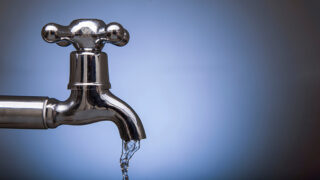 old-fashioned tap with water running from it