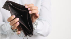 Woman Holding Empty Purse Hands Tied With Chain