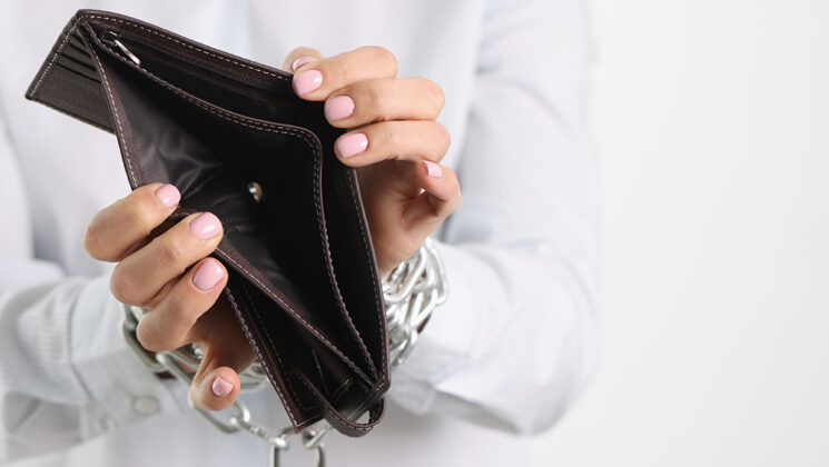 Woman Holding Empty Purse Hands Tied With Chain