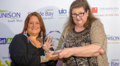 Kate Bendelow pictured with Lesley Discombe accepting a glass award for equality at UNISON's Get Active award ceremony.