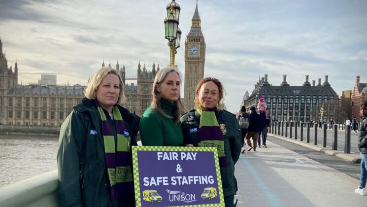 Activists stand on Westminster bridge raising awareness of the ambulance dispute.