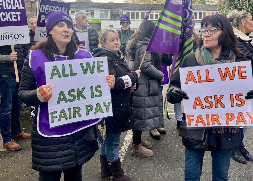 All we want is fair pay placards on the Livability picket line in Dorset.