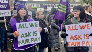 All we ask is fair pay placards on the Livability picket line in Dorset.