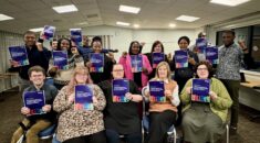 Migrant workers in Dorset holding the upcoming South West Migrant Workers Charter.