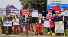 Phlebotomists on strike, joined by Mickey and Minnie Mouse.