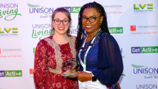 Waetsi collecting her Get Active award, presented by TUC regional secretary Ines Lage.