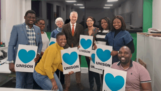 Gideon Amos with migrant workers in Taunton.