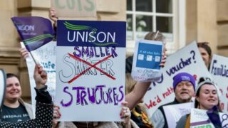 Bath and North East Somerset Council workers protesting in Bath. They're holding placards.